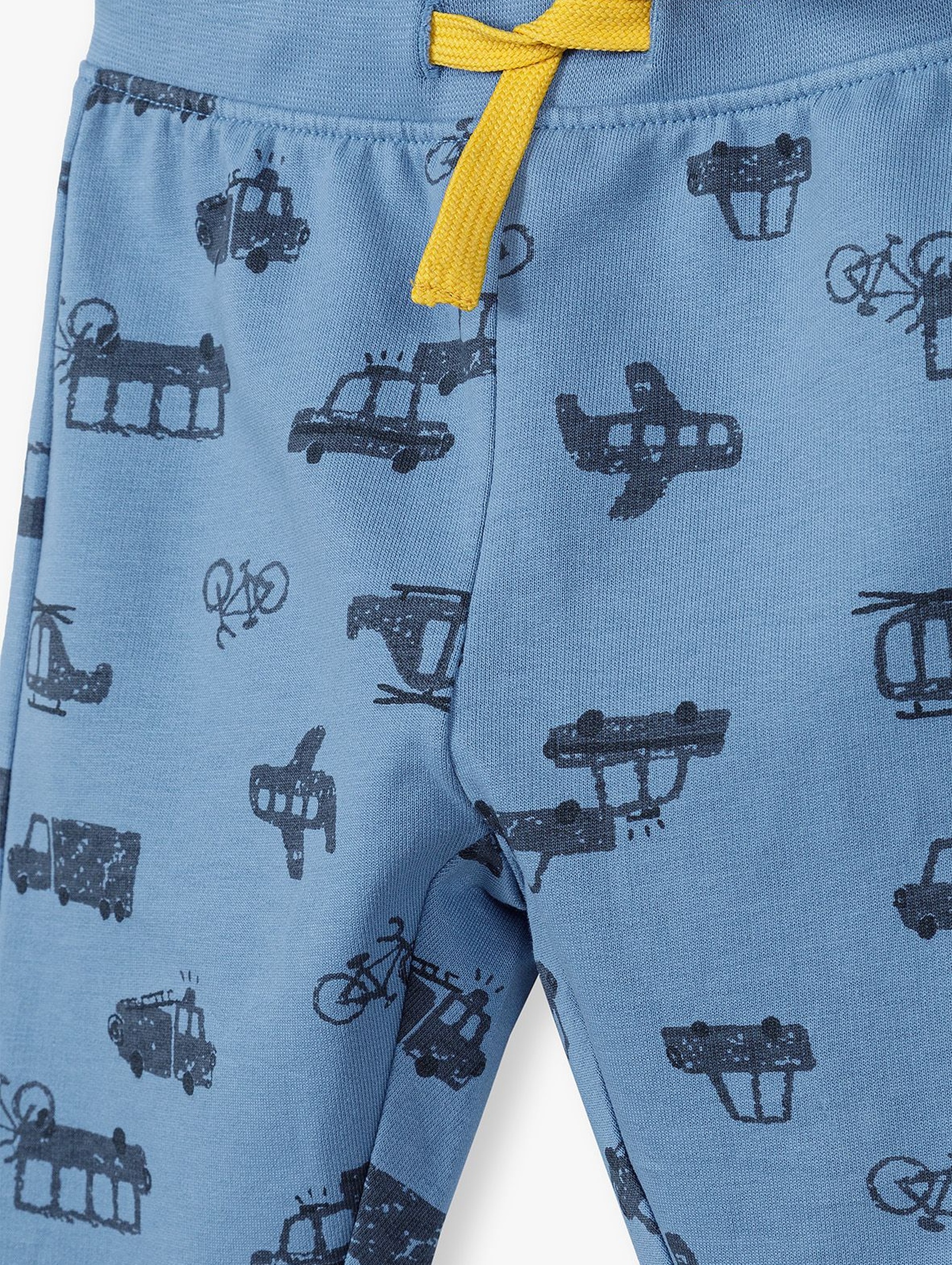 Bawełniane spodnie niemowlęce niebieskie w samochodziki