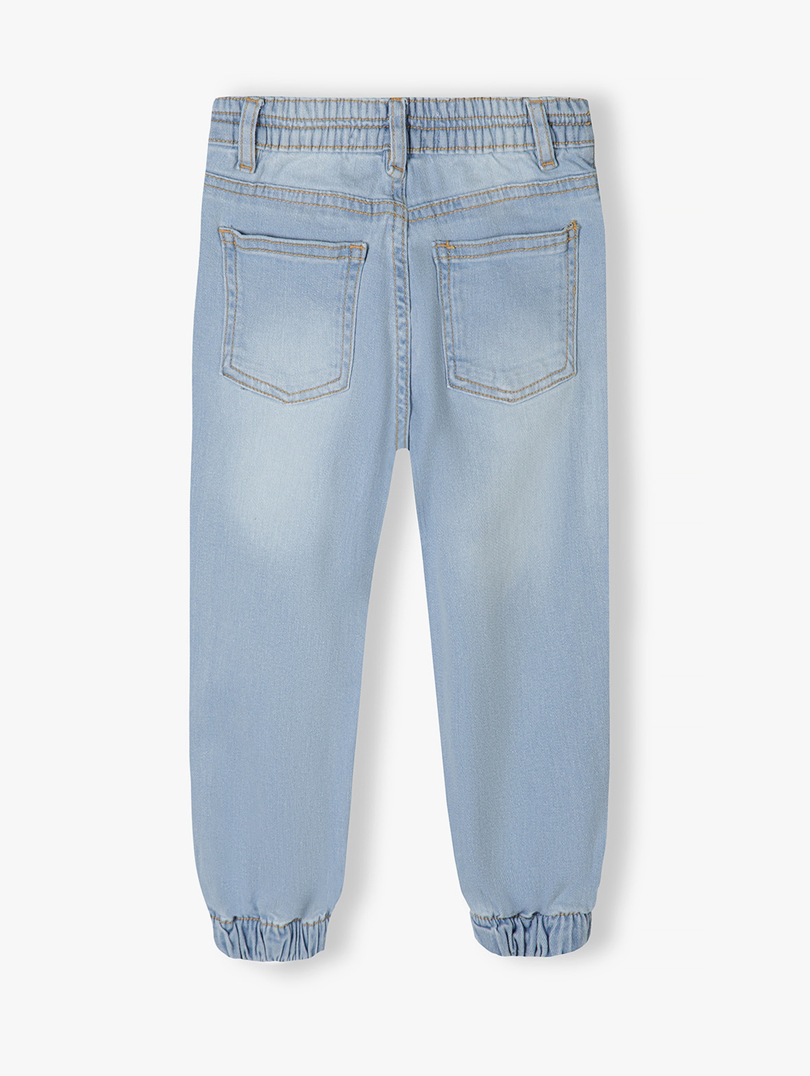 Jasne spodnie jeansowe typu joggery dziewczęce
