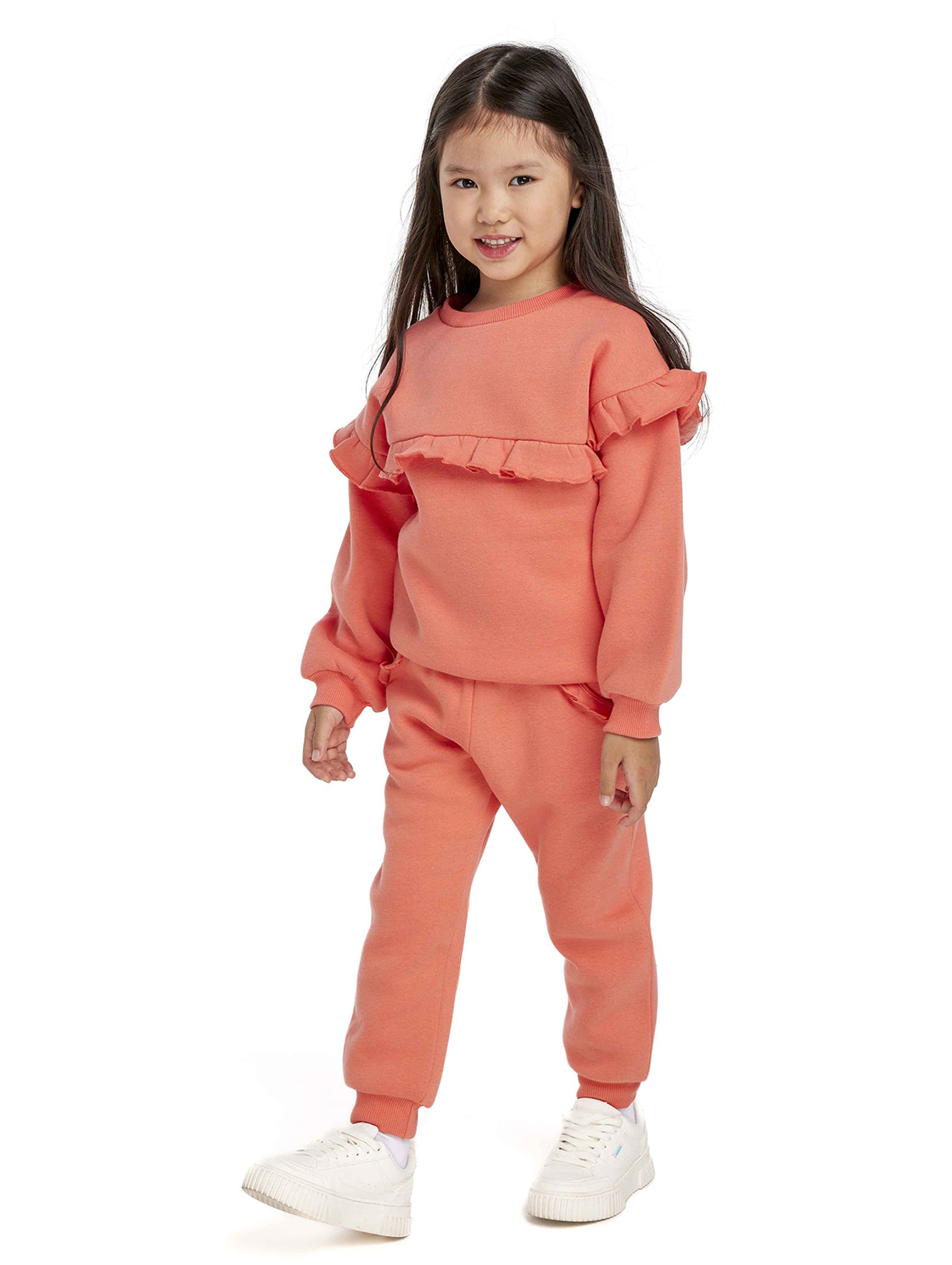 Pomarańczowe spodnie dresowe dziewczęce z falbanką - Minoti