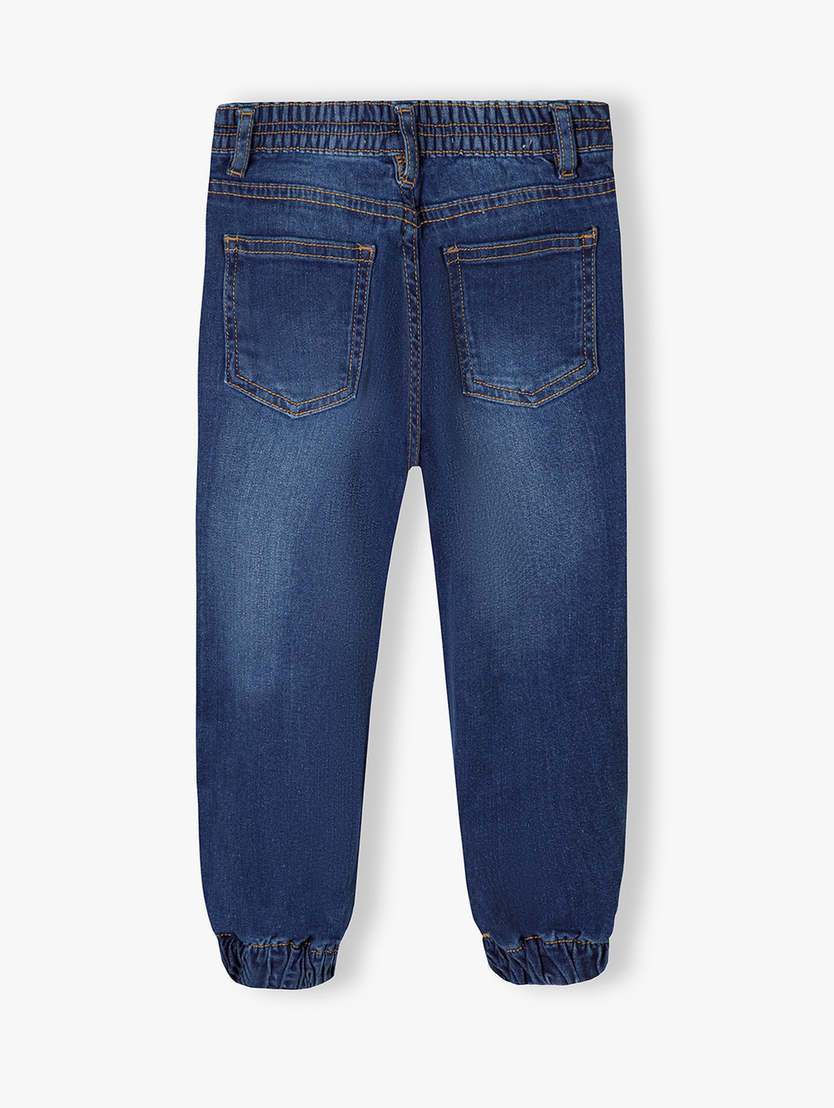 Ciemne spodnie jeansowe typu joggery dziewczęce