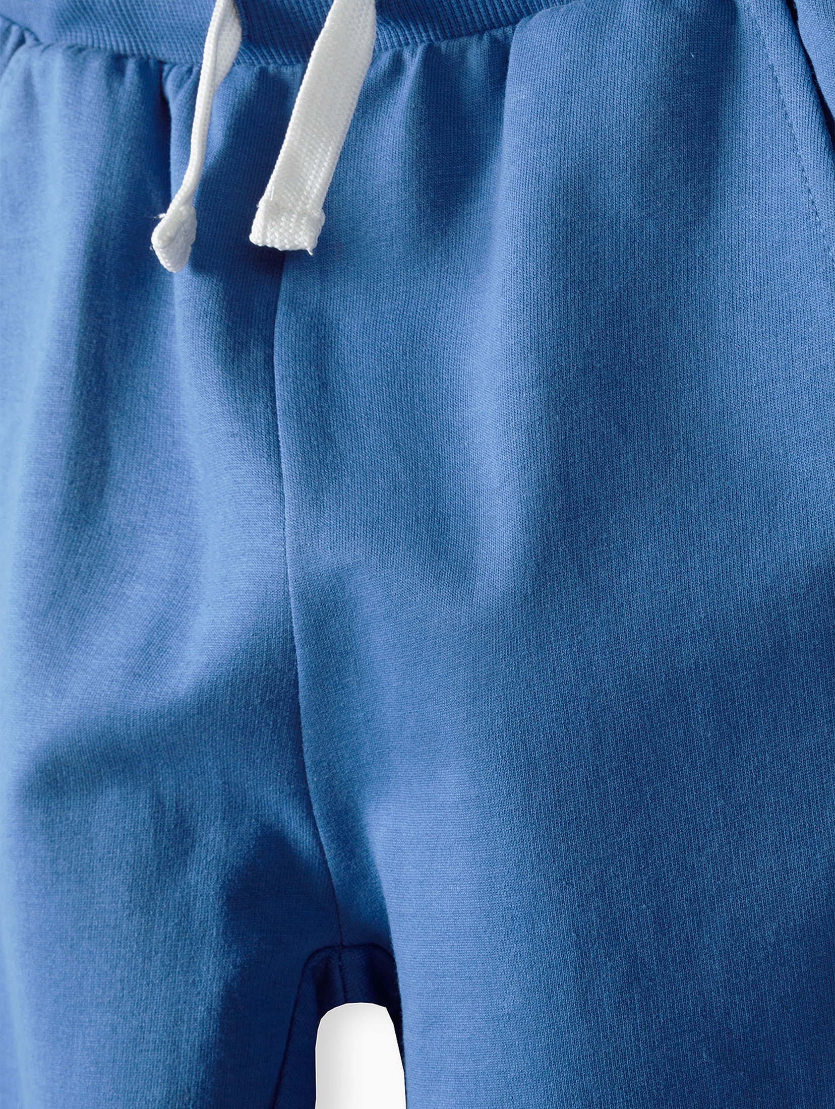 Spodnie dresowe dla chłopca bawełniane niebieskie z napisem