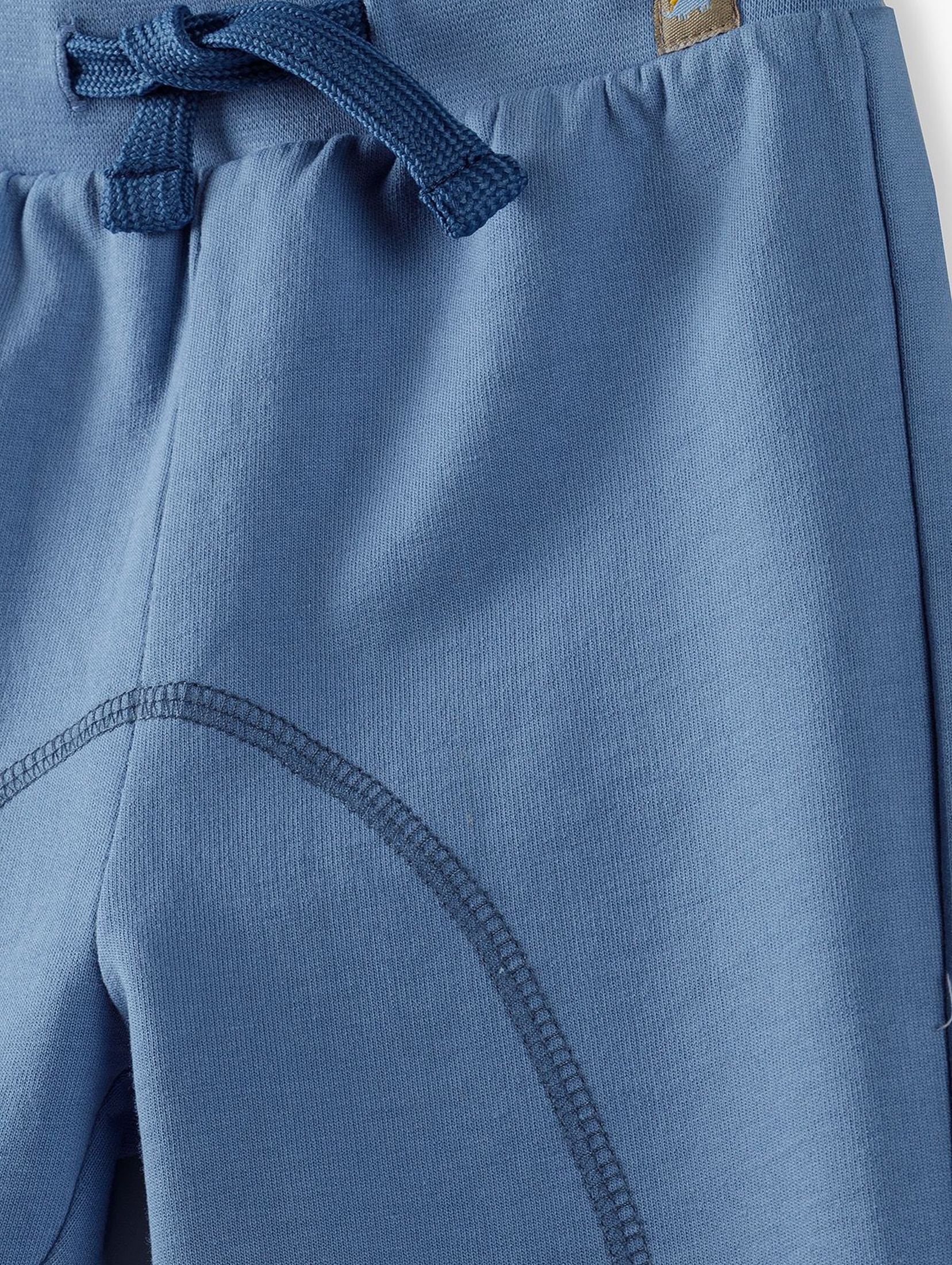 Spodnie dresowe niemowlęce ze ściągaczami- niebieskie
