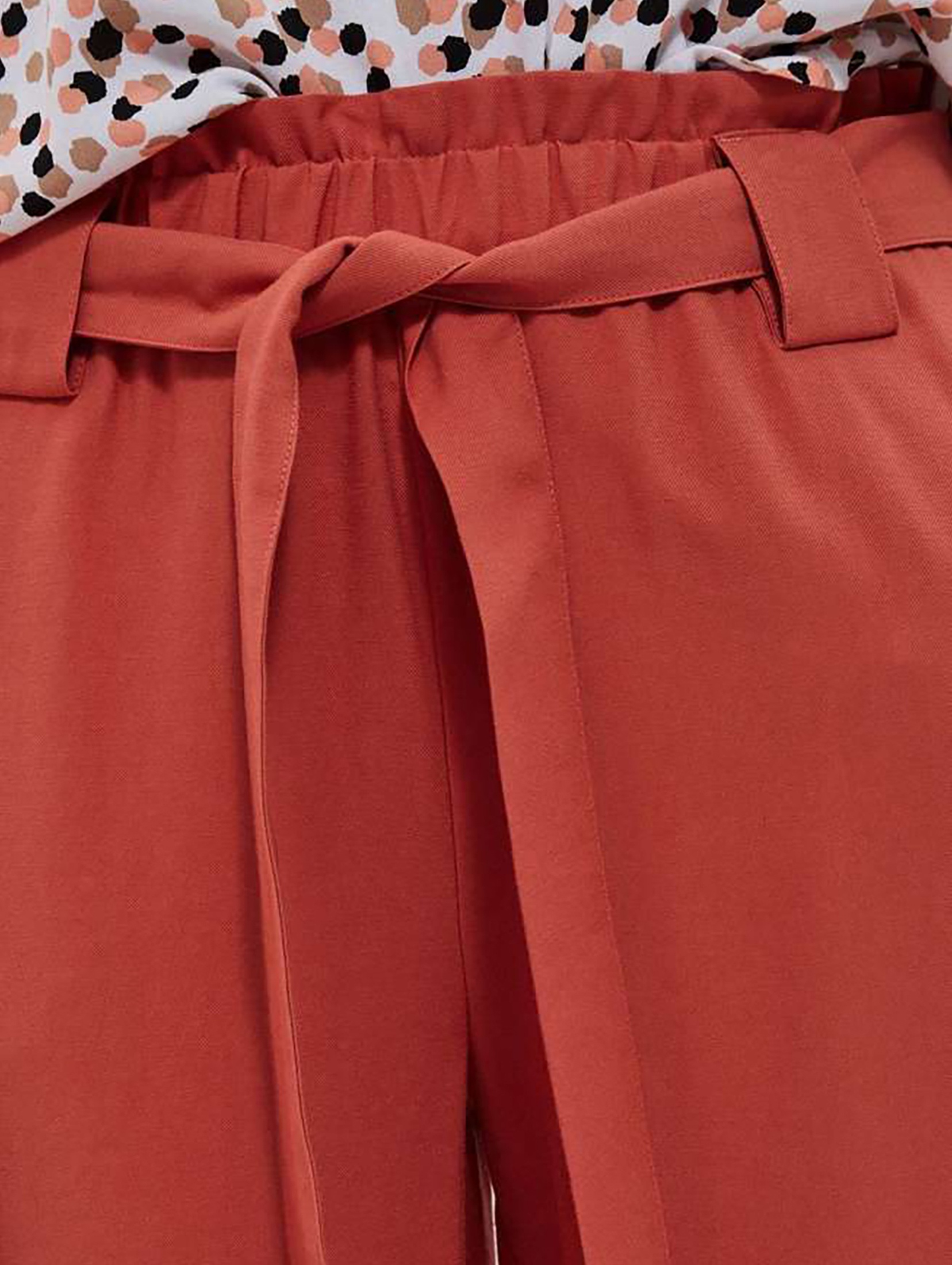 Spodnie damskie z ozdobnym wiązaniem pomarańczowe