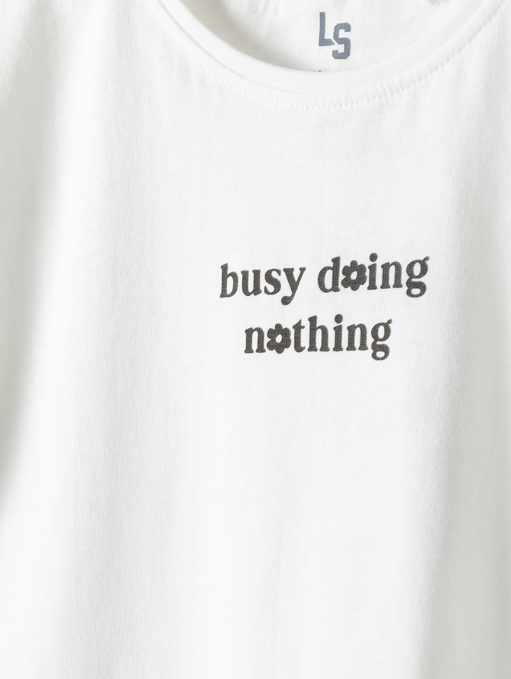 T-shirt bawełniany dla dziewczynki - biały z napisem Busy doing nothing