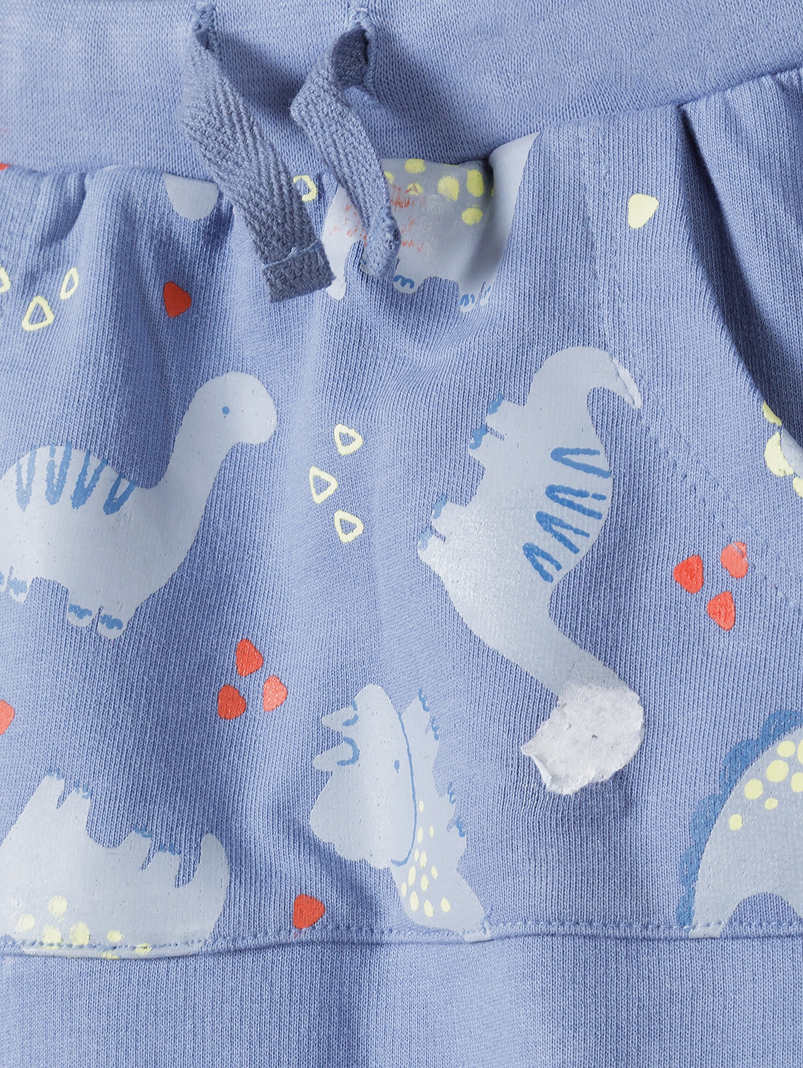 Niebieskie bawełniane spodnie niemowlęce w dinozaury