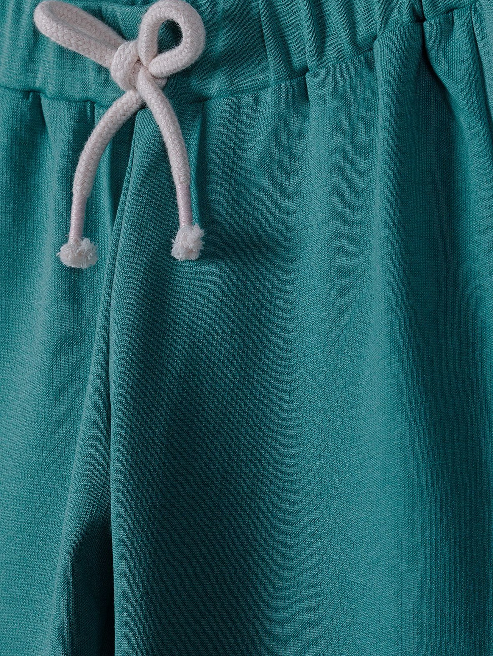 Spodnie dresowe dziewczęce z ozdobną kokardką - zielone