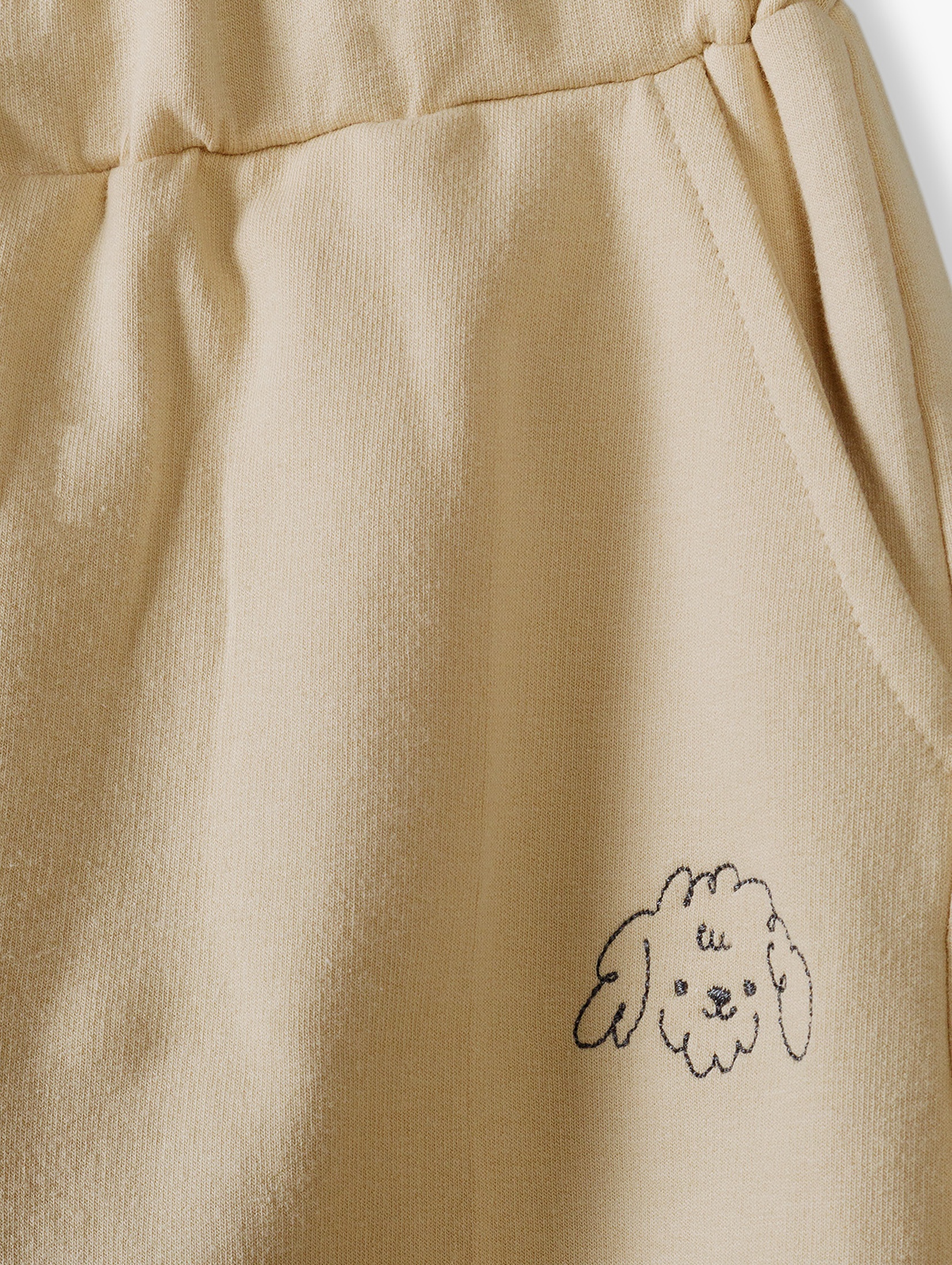 Spodnie dresowe dla dziewczynki - beżowe z pieskiem - 5.10.15.