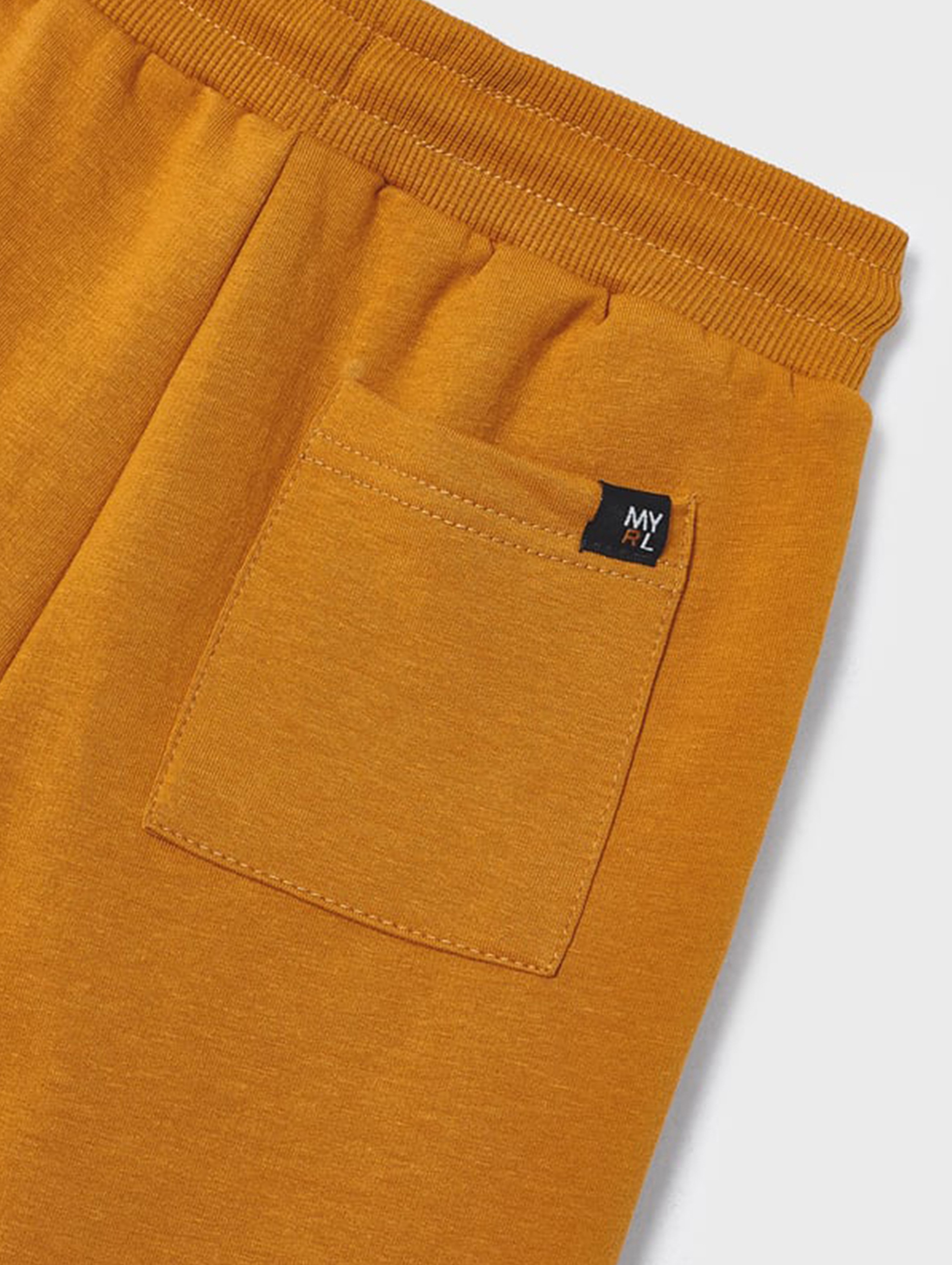 Pomarańczowe spodnie dresowe chłopięce