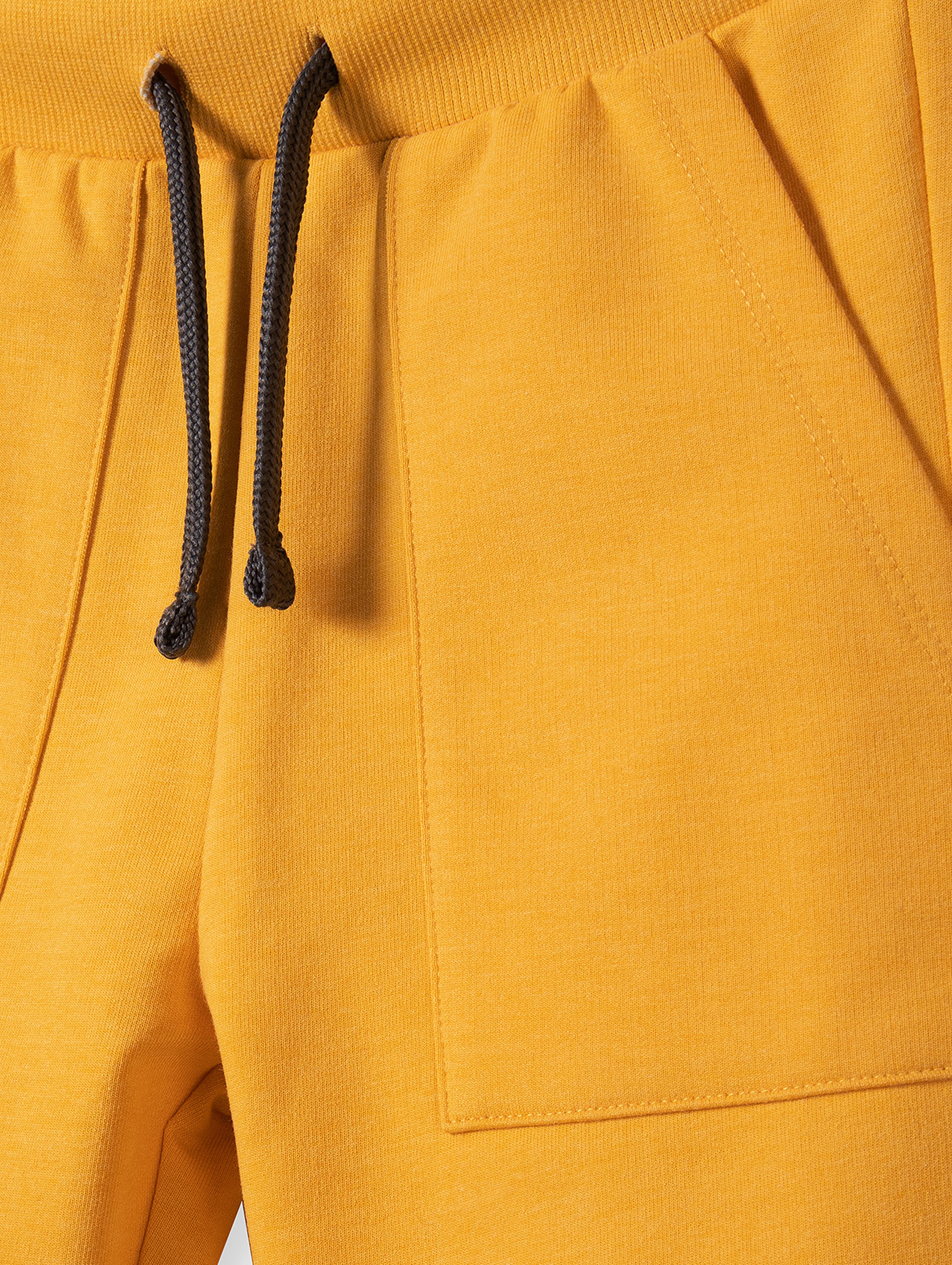 Spodnie dresowe chłopięce bawełniane z kieszeniami - żółte