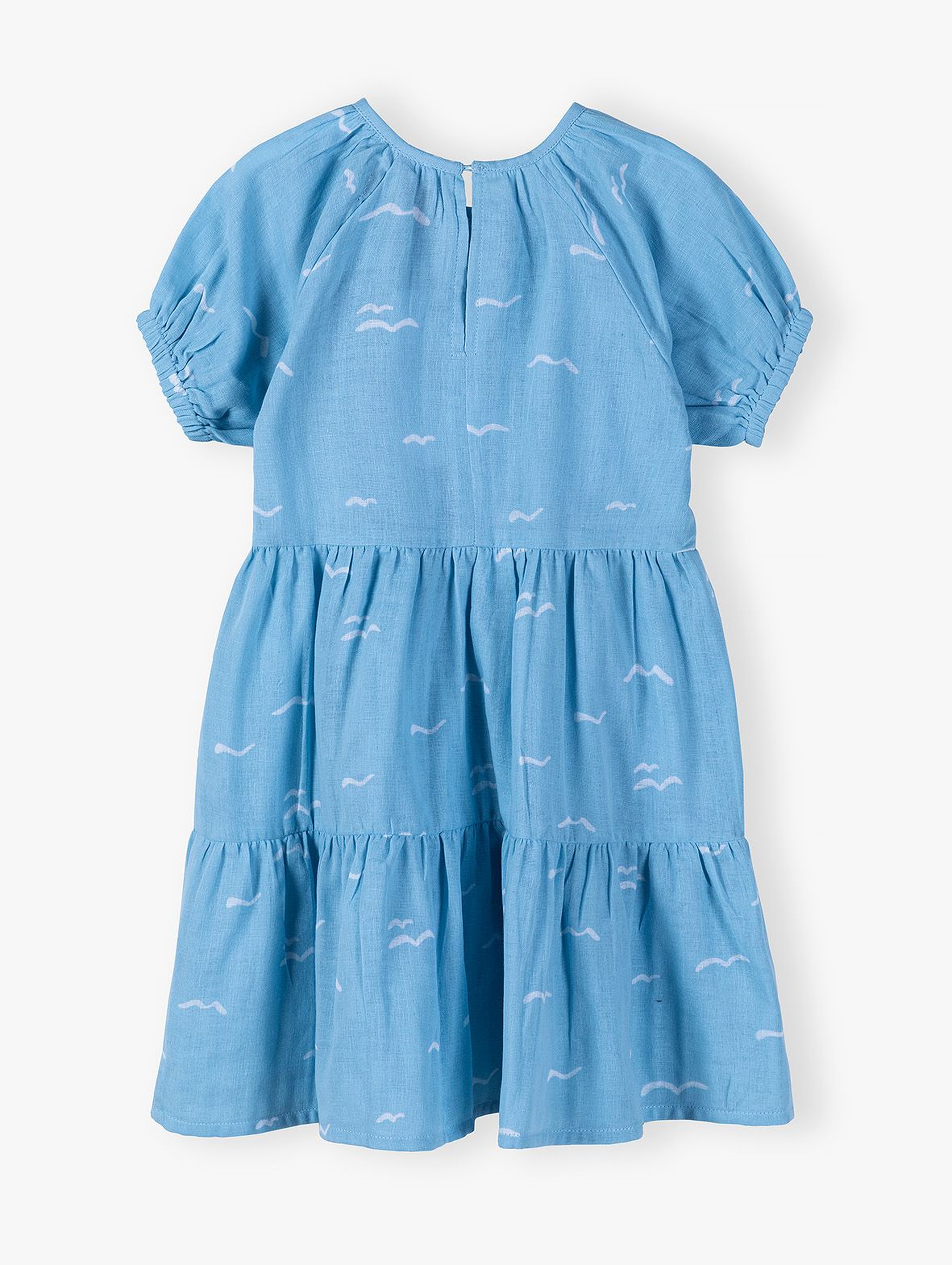 Błękitna sukienka we wzory dla dziewczynki