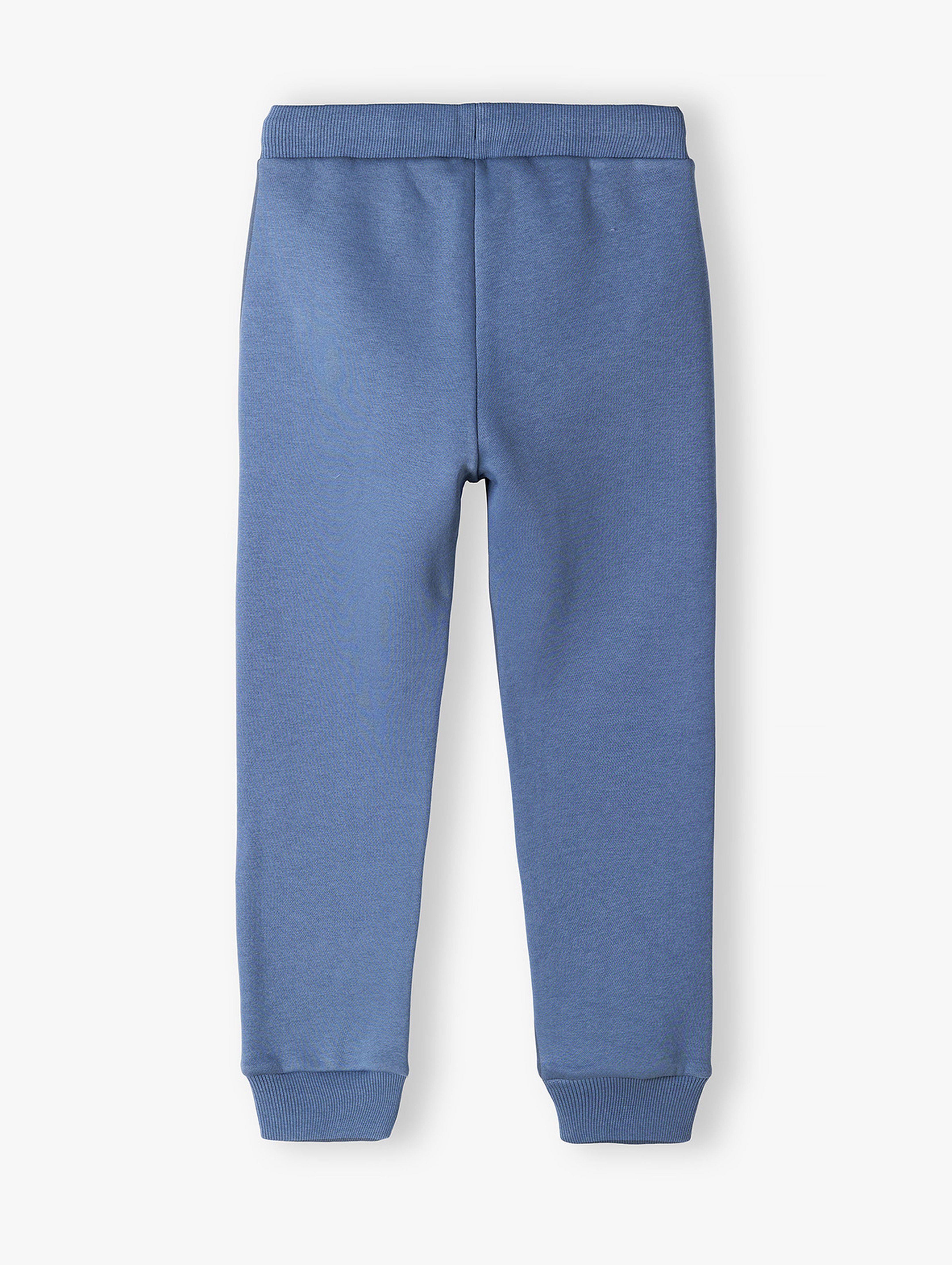 Spodnie dresowe niebieskie z napisem na nogawce- New generation