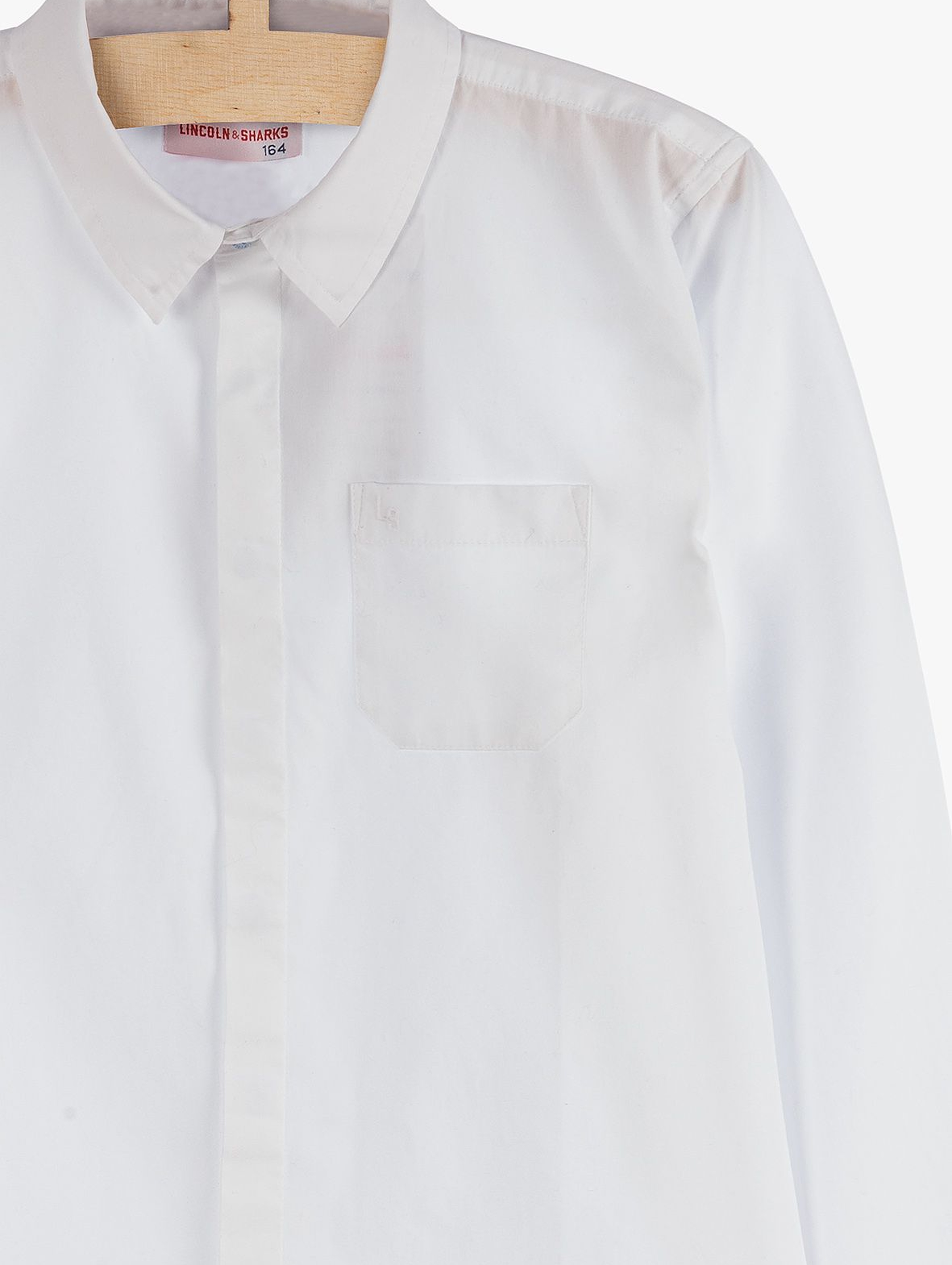 Biała elegancka koszula chłopięca z długim rękawem