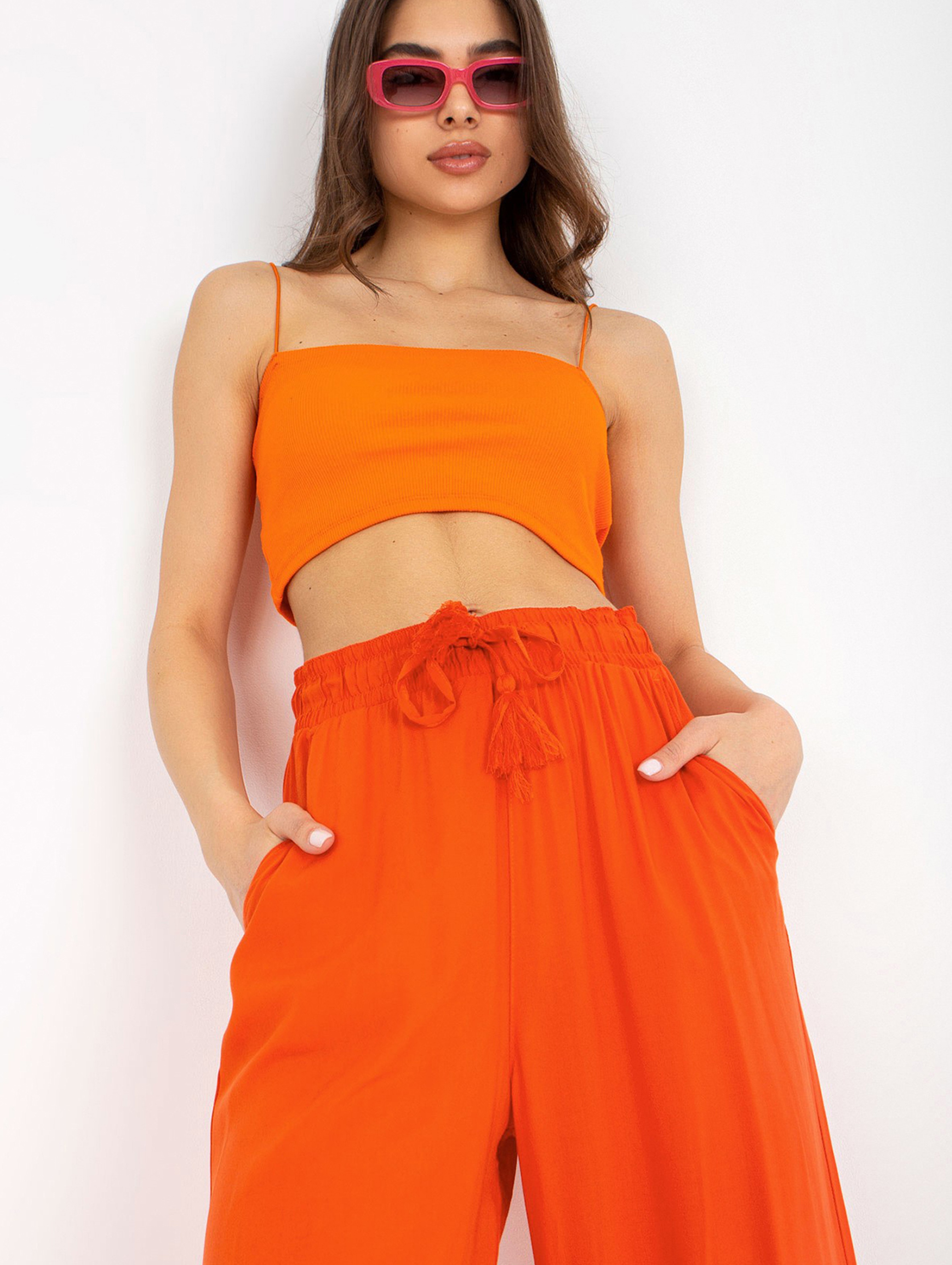 Pomarańczowe spodnie damskie z wiskozy SUBLEVEL