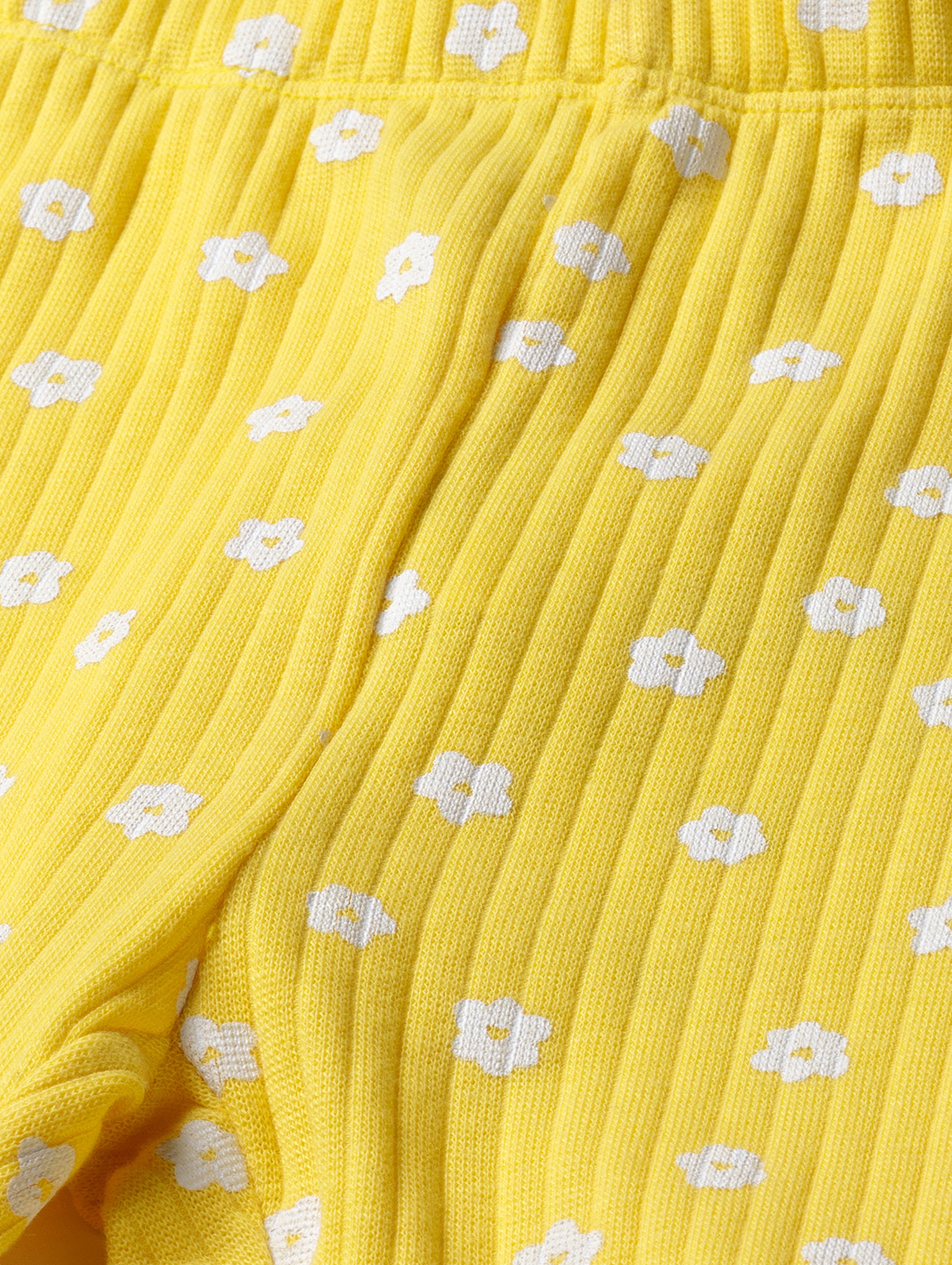Żółte legginsy dla dziewczynki w drobne kwiaty