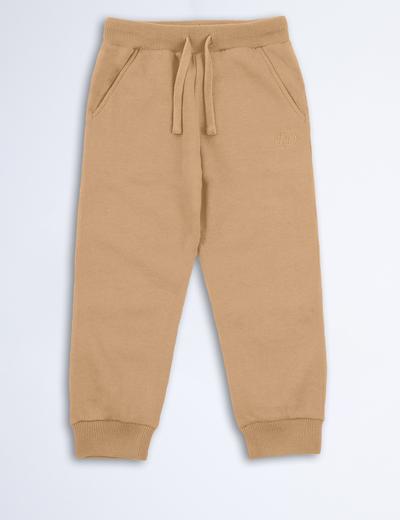 Beżowe spodnie dresowe dla dziecka - unisex - Limited Edition