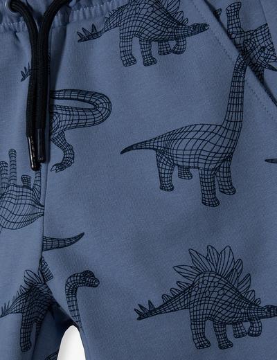 Niebieskie spodnie dresowe bawełniane regular - Dinozaury