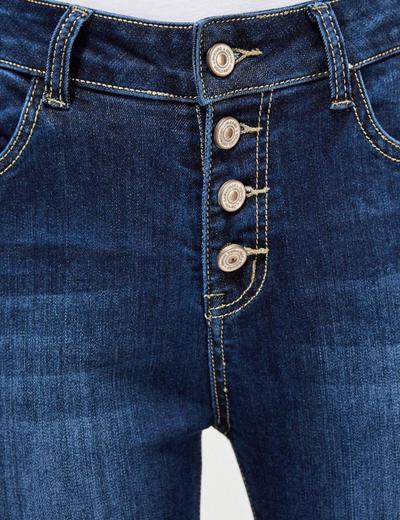 Granatowe jeansy damskie na guziki