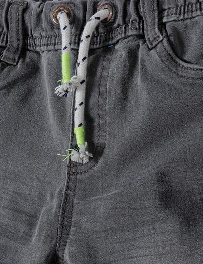 Szare jeansy ze ściągaczem oraz lekkimi przetarciami niemowlęce
