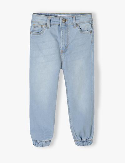 Jasne spodnie jeansowe typu joggery dziewczęce
