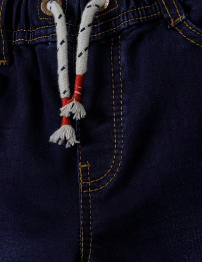 Ciemne jeansy ze ściągaczem oraz kieszeniami niemowlęce