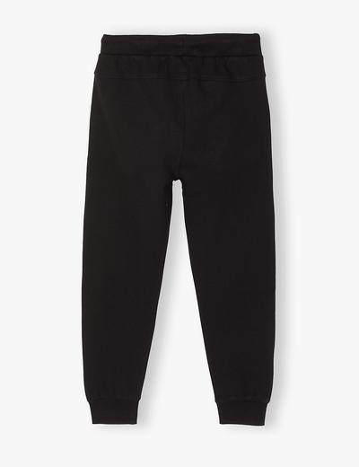 Dresowe spodnie chłopięce czarne - fason regular