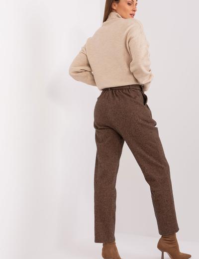 Camelowo-czarne dzianinowe spodnie w paski