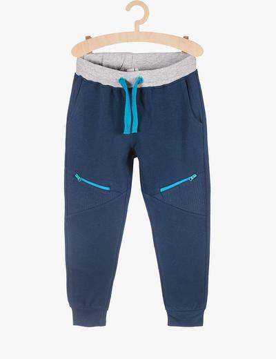 Spodnie dresowe dla chłopca - granatowe z niebieskimi wstawkami