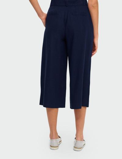 Lniane Granatowe spodnie damskie  typu kulot do połowy łydki, z paskiem