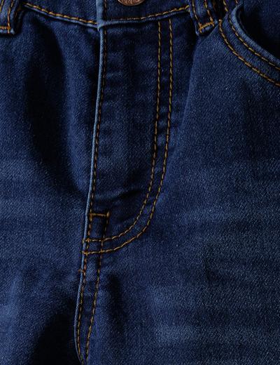 Ciemnoniebieskie klasyczne jeansy dopasowane dla niemowlaka