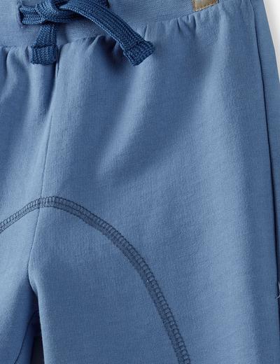 Spodnie dresowe niemowlęce ze ściągaczami- niebieskie