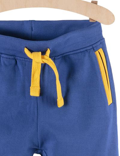 Spodnie dresowe dla chłopca niebieskie z żółtymi wstawkami