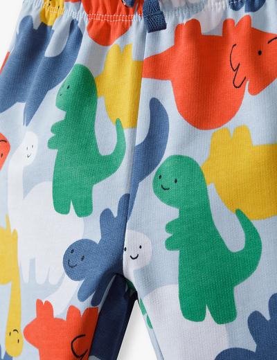 Błękitne bawełniane spodnie dresowe niemowlęce w kolorowe dinozaury