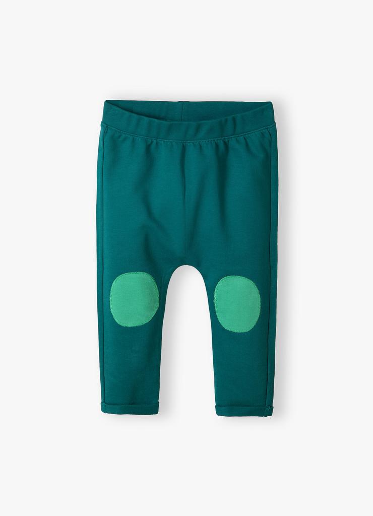 Zielone bawełniane spodnie niemowlęce z naszywkami na kolanach
